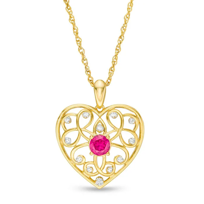40mm LabCreated Ruby and 005 CT TW Diamond Filigree Heart Pendant in 10K Yellow Gold Goldia Necklaces 40mm LabCreated Ruby and 005 CT TW Diamond Filigree Heart Pendant in 10K Yellow Gold Goldia Necklaces