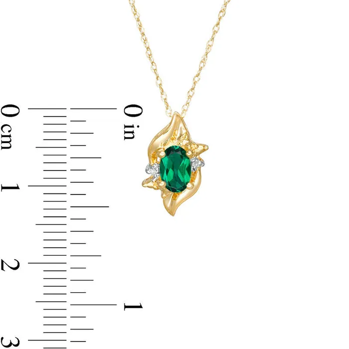 Goldia Necklaces Oval LabCreated Emerald and Diamond Accent Flame Burst Pendant in 10K Yellow Gold Goldia Necklaces Oval LabCreated Emerald and Diamond Accent Flame Burst Pendant in 10K Yellow Gold